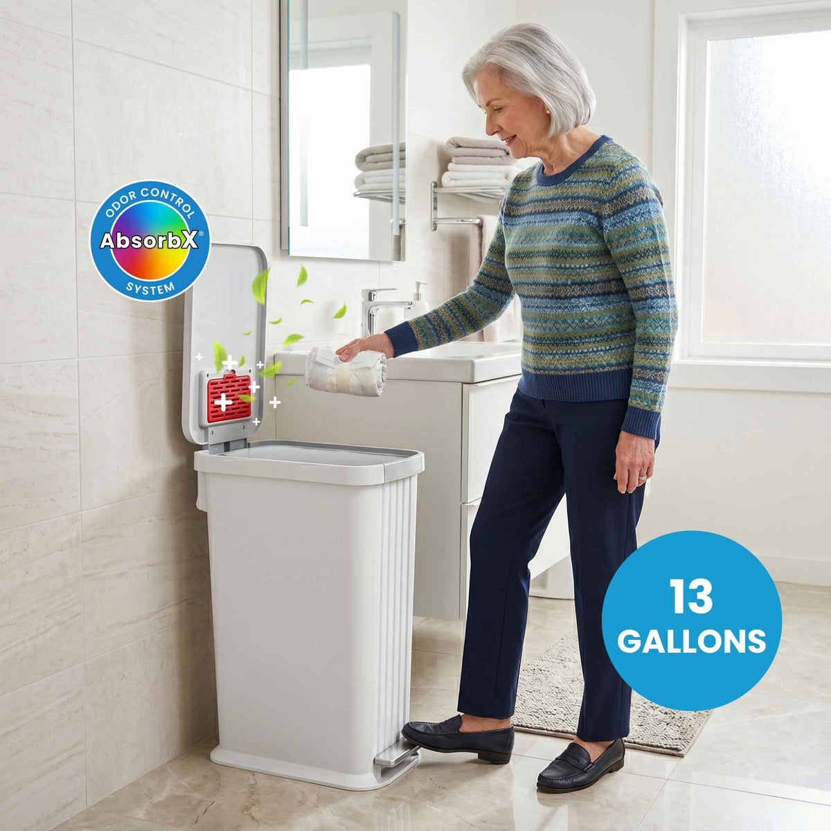 Woman using a trash can with AbsorbX odor control system in a bathroom