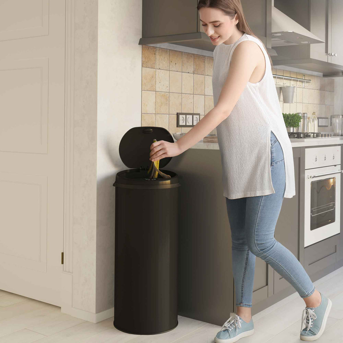 iTouchless 13 Gallon Black Stainless Steel Sensor Trash Can with Odor Filter in kitchen