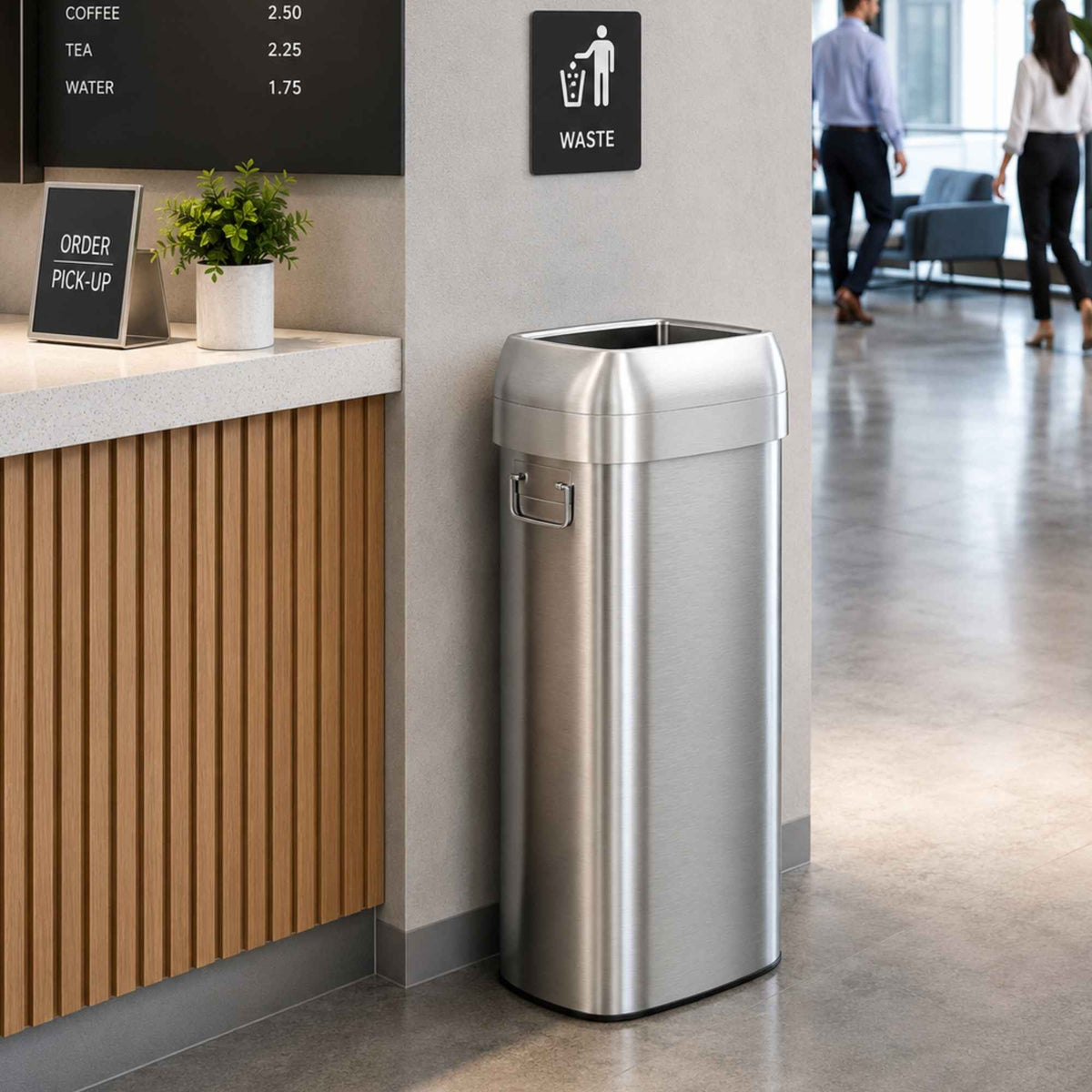 iTouchless 30 gallon open top stainless steel trash can at café pickup counter in commercial office lobby