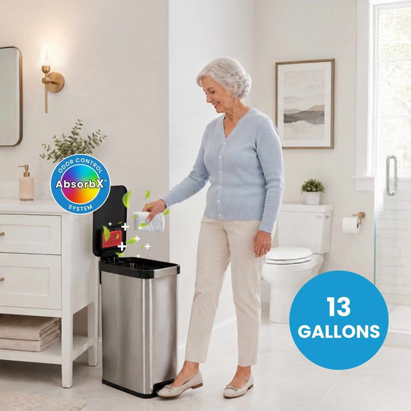 Woman using a trash can with AbsorbX odor control system in a bathroom