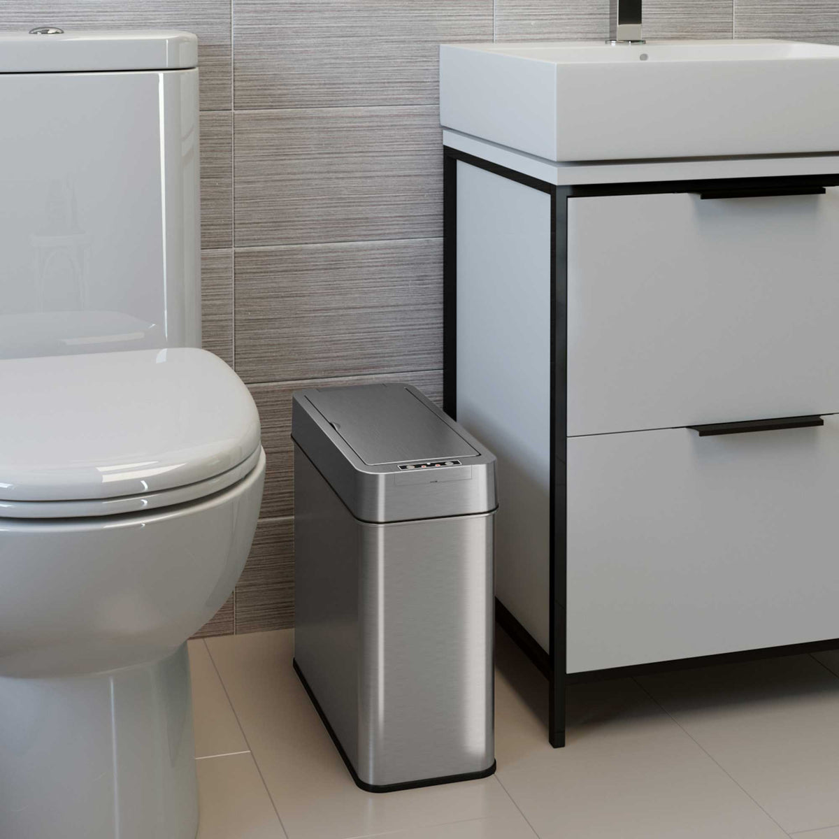 4 Gallon Stainless Steel Slim Sensor Trash Can (Right Side Lid Open) in bathroom