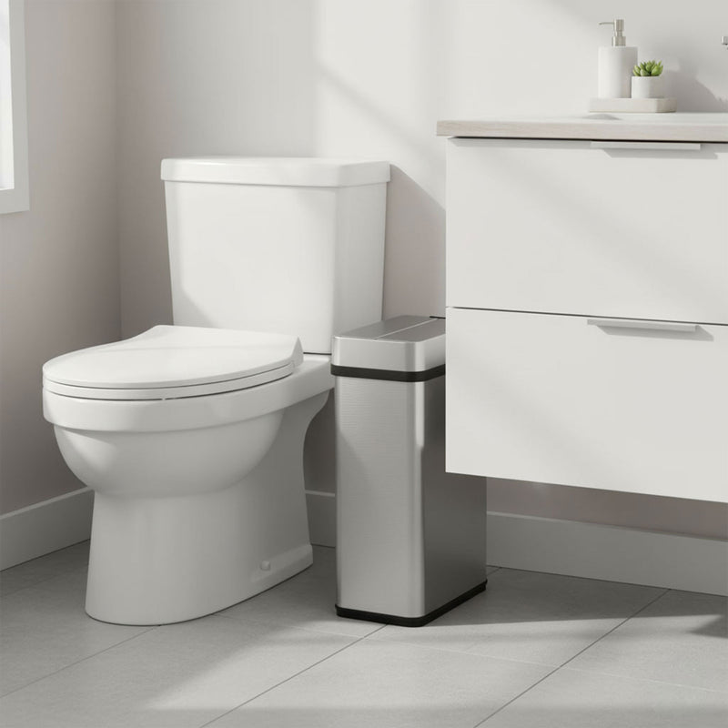 Slim iTouchless 4-gallon stainless steel sensor trash can fits neatly beside a toilet.