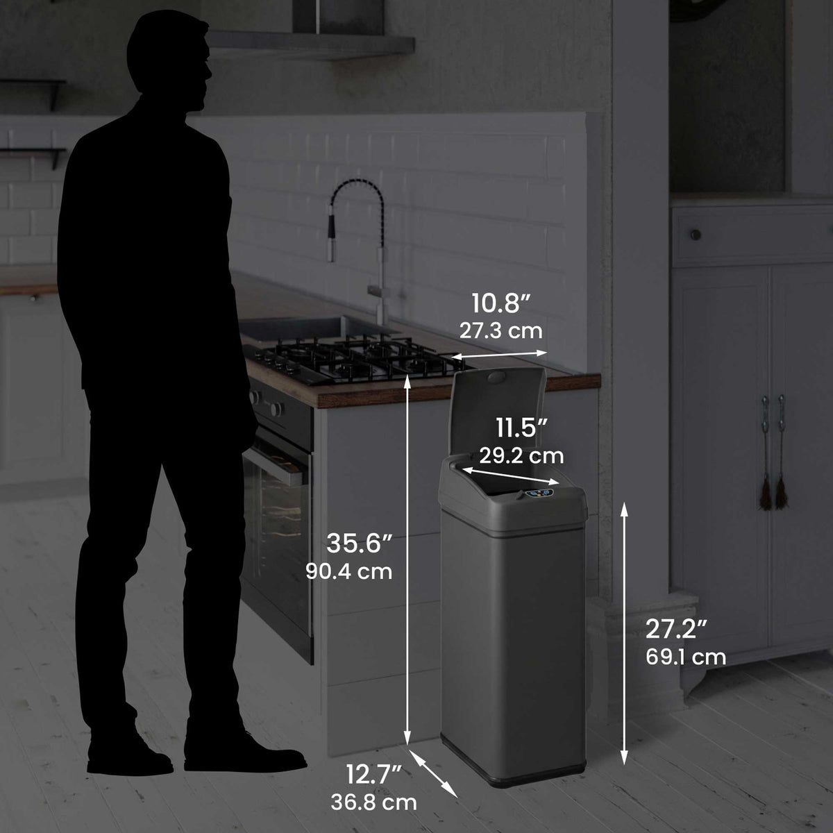Size perspective image of the iTouchless DZT13PGY trash can next to a silhouette of a person, displaying its full dimensions in inches and centimeters (27.2" height with lid open).